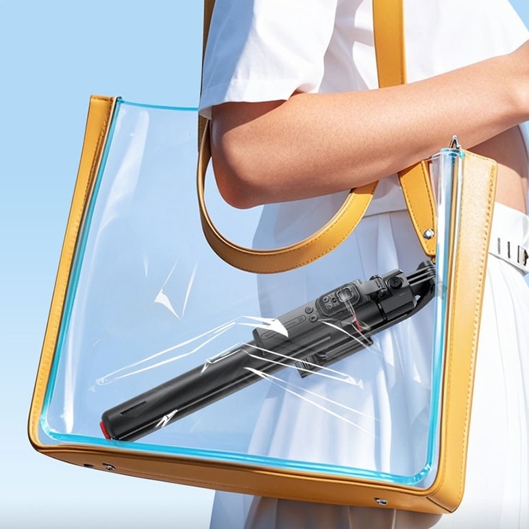 The folded tripod inside a tote bag